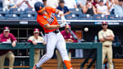 Jun 16, 2024; Omaha, NE, USA; Virginia Cavaliers second baseman Henry Godbout (2) hits a single against the Florida State Seminoles during the first inning at Charles Schwab Field Omaha. Mandatory Credit: Dylan Widger-Imagn Images
