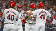 Jul 30, 2024; St. Louis, Missouri, USA;  St. Louis Cardinals pinch hitter Tommy Pham (29) celebrates with left fielder Alec Burleson (41) first baseman Paul Goldschmidt (46) and catcher Willson Contreras (40) after hitting a grand slam home run against the Texas Rangers during the fifth inning at Busch Stadium. Mandatory Credit: Jeff Curry-USA TODAY Sports