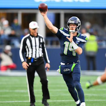 Nov 9, 2025; Seattle, Washington, USA; Seattle Seahawks quarterback Sam Darnold (14) throws a pass during the fourth quarter against the Arizona Cardinals at Lumen Field. Mandatory Credit: Steven Bisig-Imagn Images