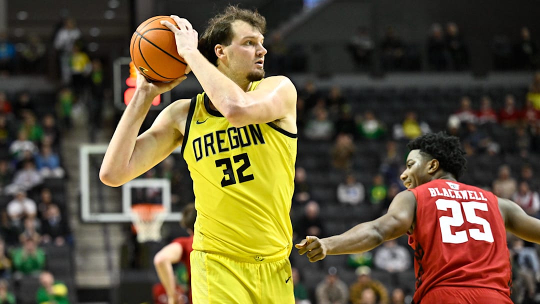 Feb 25, 2026; Eugene, Oregon, USA; Oregon Ducks center Nate Bittle (32) grabs a rebound during the second half against the Wisconsin Badgers at Matthew Knight Arena. Mandatory Credit: Craig Strobeck-Imagn Images