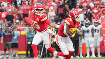 Sep 14, 2025; Kansas City, Missouri, USA; Kansas City Chiefs quarterback Patrick Mahomes (15) hands off to running back Isiah Pacheco (10) against the Philadelphia Eagles during the game at GEHA Field at Arrowhead Stadium. Mandatory Credit: Denny Medley-Imagn Images