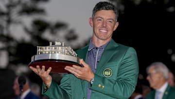 Rory McIlroy holds the Masters championship trophy during the final round of the Masters Tournament at Augusta National Golf Club.