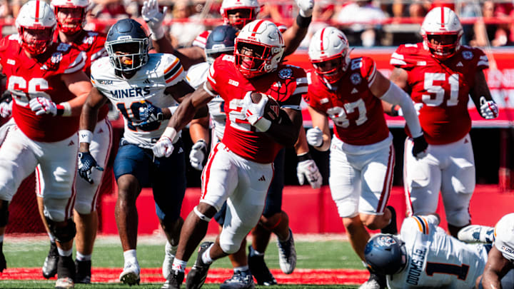 Aug 31, 2024; Lincoln, Nebraska, USA; Nebraska Cornhuskers running back Emmett Johnson (21) runs against the UTEP Miners during the second quarter at Memorial Stadium. 