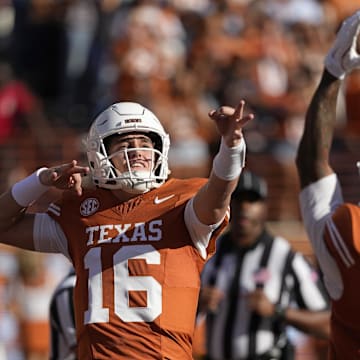 Manning (#16) had a lot to celebrate about in Texas‘ big win over Arkansas. 