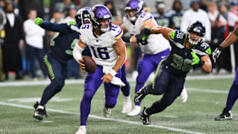 Aug 10, 2023; Seattle, Washington, USA; Minnesota Vikings quarterback Jaren Hall (16) carries the ball while being chased by Seattle Seahawks linebacker Levi Bell (98) during the second half at Lumen Field.