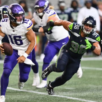 Aug 10, 2023; Seattle, Washington, USA; Minnesota Vikings quarterback Jaren Hall (16) carries the ball while being chased by Seattle Seahawks linebacker Levi Bell (98) during the second half at Lumen Field.