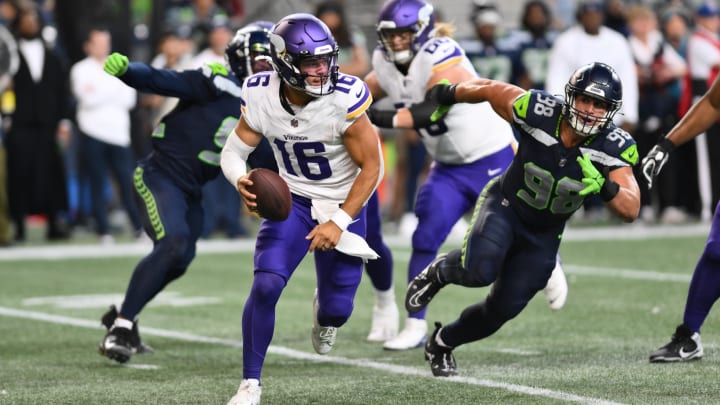 Aug 10, 2023; Seattle, Washington, USA; Minnesota Vikings quarterback Jaren Hall (16) carries the ball while being chased by Seattle Seahawks linebacker Levi Bell (98) during the second half at Lumen Field.