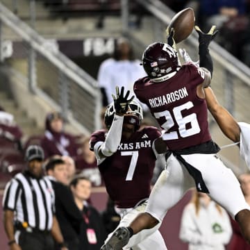 Nov 11, 2023; College Station, Texas, USA; Texas A&M Aggies defensive back Demani Richardson (26) breaks up a pass in the end zone intended for Mississippi State Bulldogs wide receiver Justin Robinson (3) at Kyle Field. Mandatory Credit: Maria Lysaker-USA TODAY Sports