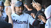 Miami Marlins second baseman Xavier Edwards (9) is congratulated by teammates after scoring a run against the Washington Nationals during the fifth inning at Nationals Park. 