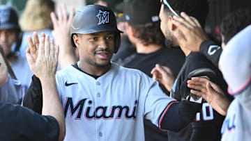 Miami Marlins second baseman Xavier Edwards (9) is congratulated by teammates after scoring a run against the Washington Nationals during the fifth inning at Nationals Park. 