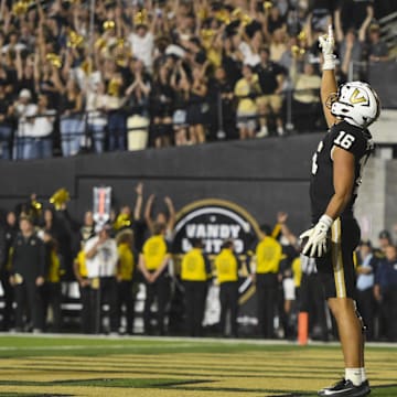 Nov 8, 2025; Nashville, Tennessee, USA;  Vanderbilt Commodores tight end Cole Spence (16) celebrates the touchdown against the Auburn Tigers during the overtime period  at FirstBank Stadium. Mandatory Credit: Steve Roberts-Imagn Images