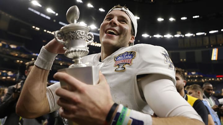 Jan 2, 2025; New Orleans, LA, USA; Notre Dame Fighting Irish quarterback Riley Leonard (13) celebrates with fans in the stands after defeating the Georgia Bulldogs at Caesars Superdome. Mandatory Credit: Amber Searls-Imagn Images