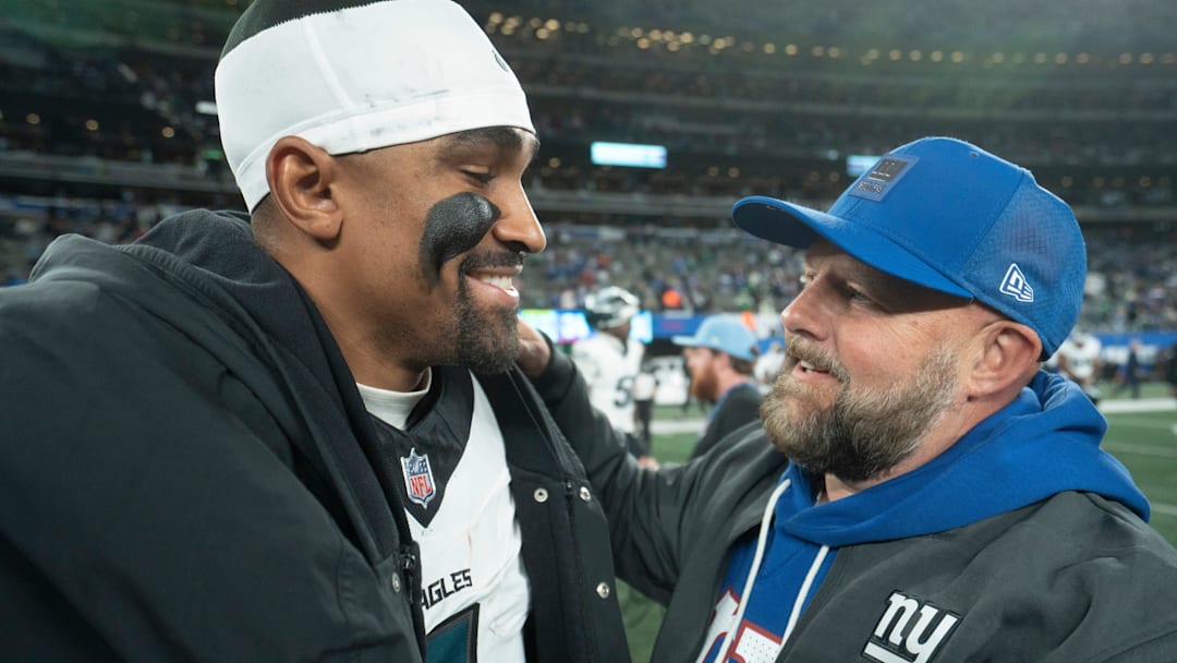 Philadelphia Eagles quarterback Jalen Hurts (1) talks with New York Giants head coach Brian Daboll after a Thursday Night Football game between the New York Giants and the Philadelphia Eagles at MetLife Stadium in East Rutherford on Oct. 9, 2025.