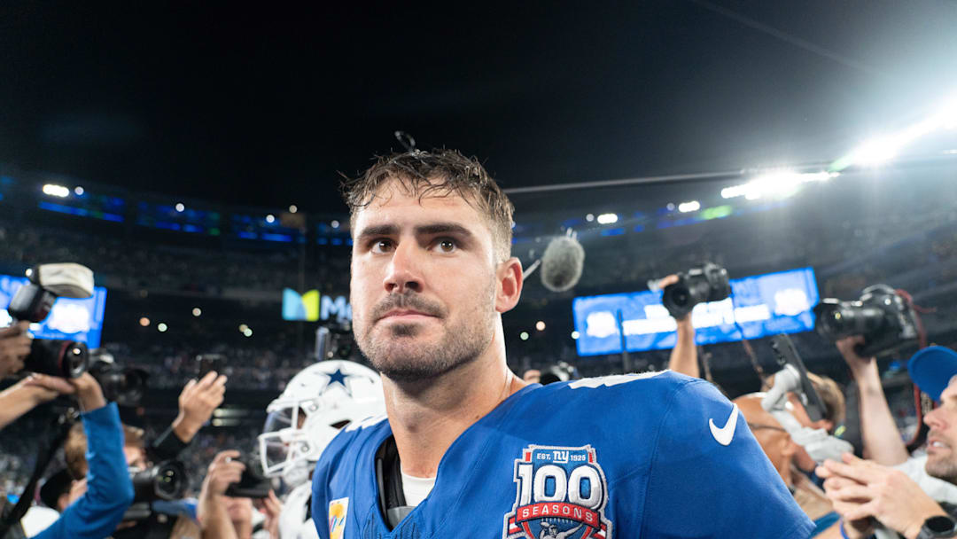 Sep 26, 2024; East Rutherford, NJ, US; New York Giants quarterback Daniel Jones (8) embraces Dallas Cowboys quarterback Dak Prescott (4) following the end of the game at MetLife Stadium. Mandatory Credit: Julian Guadalupe-NorthJersey.com