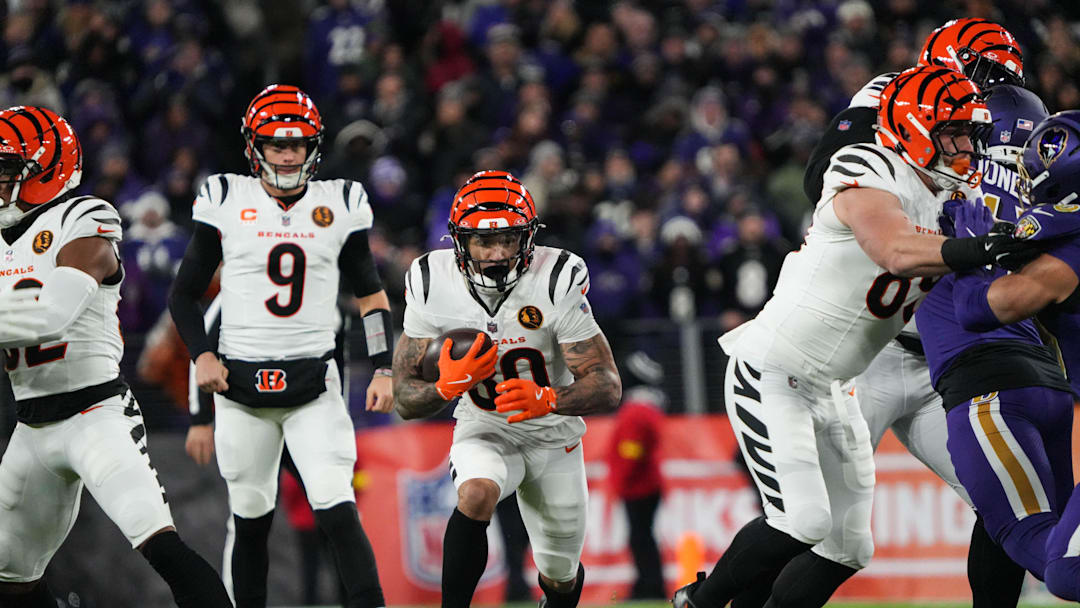 Bengals Chase Brown (30) takes the ball down the field during their game against the Ravens at M&T Bank Stadium on Thanksgiving Thursday November 27, 2025.