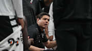 Bearcats Head Coach Wes Miller talks to his players during a timeout in Game 1 of the 2025 Phillips 66 Big 12 Basketball Championship against the Oklahoma State Cowboys at the T-Mobile Center in Kansas City, Missouri on Tuesday March 11, 2025. Bearcats won the game with a final score of 87-68.
