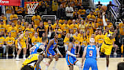 Jun 11, 2025; Indianapolis, Indiana, USA; Indiana Pacers guard Bennedict Mathurin (00) shoots the ball against Oklahoma City Thunder guard Alex Caruso (9)  in game three of the 2025 NBA Finals at Gainbridge Fieldhouse. Mandatory Credit: Kyle Terada-Imagn Images
