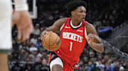 Nov 9, 2025; Milwaukee, Wisconsin, USA;  Houston Rockets guard Amen Thompson (1) drives to the basket against the Milwaukee Bucks in the first half at Fiserv Forum. Mandatory Credit: Michael McLoone-Imagn Images