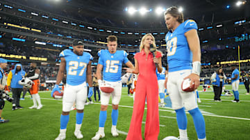 Nov 17, 2024; Inglewood, California, USA; NBC Sunday Night Football sideline reporter Melissa Stark (second from right) interviews Los Angeles Chargers quarterback Justin Herbert (10), running back J.K. Dobbins (27) and wide receiver Ladd McConkey (15) after the game against the Cincinnati Bengals at SoFi Stadium. Mandatory Credit: Kirby Lee-Imagn Images