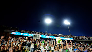 Oregon fans cheer during following Women's College World Series softball game between the Oregon Ducks and the Ole Miss Rebels at Devon Park in Oklahoma City, Friday, May, 30, 2025.