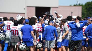 Jul 26, 2024; East Rutherford, NJ, USA; New York Giants players huddle at the end of training camp at Quest Diagnostics Training Center.  