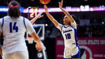 Johnston's Jenica Lewis (10) shoots a three during the Class 5A final against Dowling Catholic on Friday, March 7, 2025, at Wells Fargo Arena.