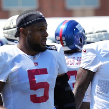 Jul 26, 2024; East Rutherford, NJ, USA; New York Giants linebacker Kayvon Thibodeaux (5) and New York Giants linebacker Brian Burns (0) break on the sideline during training camp at Quest Diagnostics Training Center.  
