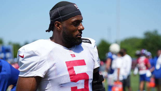 Jul 26, 2024; East Rutherford, NJ, USA; New York Giants linebacker Kayvon Thibodeaux (5) walks the sideline during training c