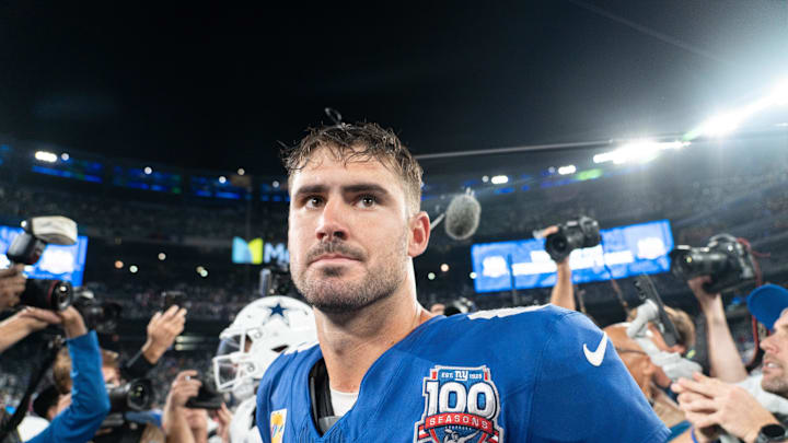 Sep 26, 2024; East Rutherford, NJ, US; New York Giants quarterback Daniel Jones (8) embraces Dallas Cowboys quarterback Dak Prescott (4) following the end of the game at MetLife Stadium. Mandatory Credit: Julian Guadalupe-NorthJersey.com