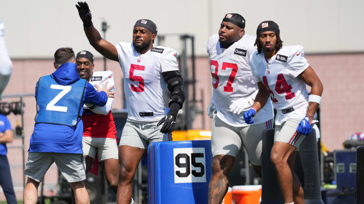 Jul 26, 2024; East Rutherford, NJ, USA; New York Giants linebacker Kayvon Thibodeaux (5) does a drill alongside New York Giants defensive tackle Dexter Lawrence (97) and New York Giants cornerback Nick McCloud (44) during training camp at Quest Diagnostics Training Center. Mandatory Credit: Lucas Boland-USA TODAY Sports