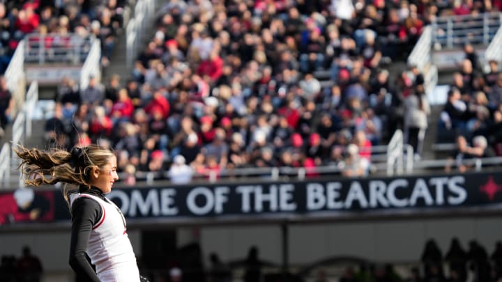 Cheerleaders entertain the crowds during pauses in the UC vs. UCF game at Nippert Stadium on Saturday November 4, 2023. UCF leads the game at halftime with a score of 14-10.