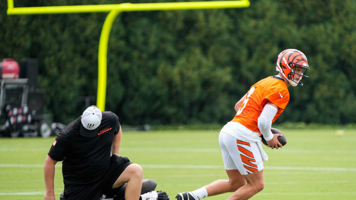 bengals Joe Burrow takes off with the ball during their training camp on Thursday July 29, 2024.