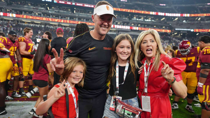 Sep 1, 2024; Paradise, Nevada, USA; Southern California Trojans head coach Lincoln Riley with wife Caitlin Riley and daughters Sloan Riley and Stella Riley after the game against the LSU Tigers at Allegiant Stadium. Mandatory Credit: Kirby Lee-USA TODAY Sports