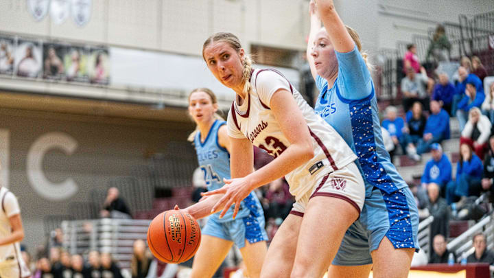 Dowling Catholic's Ellie Muller (23) takes possession of the ball during a game against Waukee Northwest on Friday, Feb. 7, 2025, at Dowling Catholic High School.