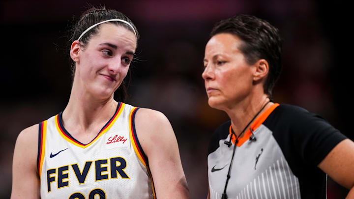 Indiana Fever guard Caitlin Clark (22) smiles at an official during a game between the Indiana Fever and the Connecticut Sun at Gainbridge Fieldhouse in Indianapolis. The Fever defeated the Sun, 84-80.