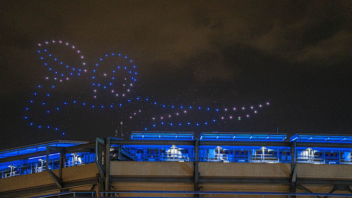 Drones form a quarterback as part of a drone show during the Giants Fan Fest, celebrating 100 seasons, at MetLife Stadium on Friday, Sept. 6, 2024.