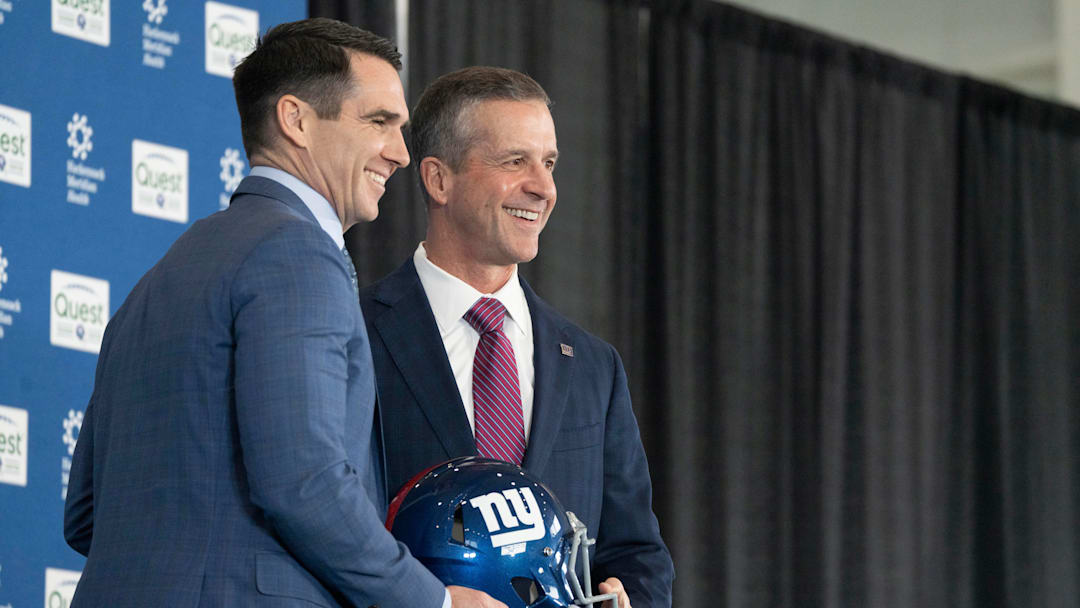 General Manager Joe Schoen and new Giants head coach John Harbaugh hold a NY Giants helmet during a press conference welcoming Harbaugh at the Quest Diagnostics Training Center in East Rutherford on Tuesday, Jan. 20, 2025.