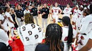 Louisville Cardinals head coach Jeff Walz talks to the Cards after their win over Southern Indiana University Friday night at the KFC Yum! Center in Louisville, Ky. Nov. 8, 2024.