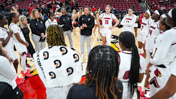 Louisville Cardinals head coach Jeff Walz talks to the Cards after their win over Southern Indiana University Friday night at the KFC Yum! Center in Louisville, Ky. Nov. 8, 2024.