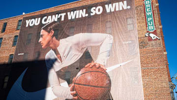 Nike banners featuring Caitlin Clark are installed along the eastern side of Des Moines' Court Avenue Restaurant and Brewing Company on Thursday, Feb. 20, 2025.