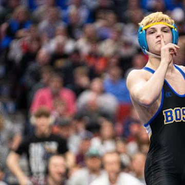 Don Bosco's Hayden Schwab wins over Wilton's Liam Adlfinger wrestles at 120 lbs during the Class 1A state wresting final on Saturday, Feb. 22, 2025, at Wells Fargo Arena in Des Moines.