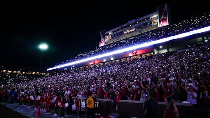 Fans hold up their phones to light up the stadium during a college football game between the University of Oklahoma Sooners (OU) and the Houston Cougars at Gaylord Family – Oklahoma Memorial Stadium in Norman, Okla., Saturday, Sept. 7, 2024.