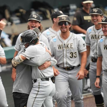 The Wake Forest baseball team celebrates after Wake Forest infielder Marek Houston (7) hits a home run during a NCAA regional baseball game between the Cincinnati Bearcats and Wake Forest Demon Deacons at Lindsey Nelson Stadium in Knoxville, Tenn., on June 1, 2025.