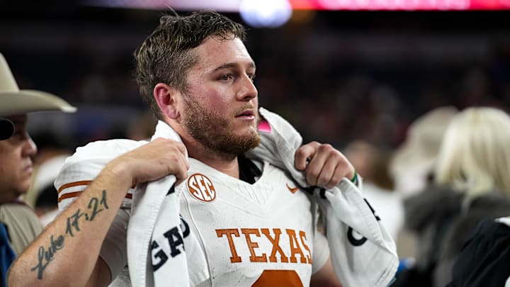 Texas Longhorns quarterback Quinn Ewers (3) looks into the crowd after the 28-14 loss to Ohio State in the College Football Playoff semifinal game in the Cotton Bowl at AT&T. Texas Longhorns quarterback Quinn Ewers (3) looks into the crowd after the 28-14 loss to Ohio State in the College Football Playoff semifinal game in the Cotton Bowl at AT&T.