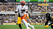 Bengals Tee Higgins (5) takes the ball down the field during their game against the Steelers on Sunday November 16, 2025 at Acrisure Stadium.