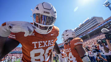 Texas Longhorns offensive lineman Malik Agbo (80) celebrates a touchdown late in the fourth quarter against the Oklahoma Sooners during an NCAA college football game at the Cotton Bowl on Saturday, Oct. 7, 2023.