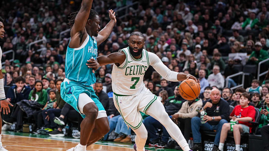 Boston Celtics guard Jaylen Brown (7) drives the ball against Charlotte Hornets guard Sion James 