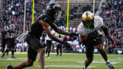 UCF's safety Nikai Martinez (21) catches and interception during the UC vs. UCF game at Nippert