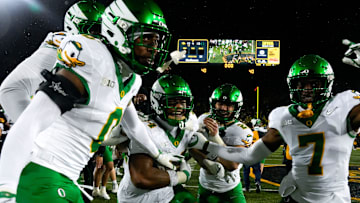 The Oregon Ducks celebrate after defeating the Iowa Hawkeyes Nov. 8, 2025 during a Big Ten Football game at Kinnick Stadium in Iowa City, Iowa.