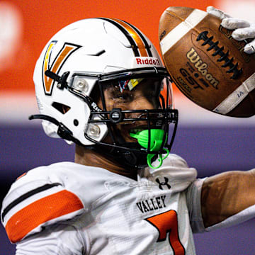 WDM Valley's Jayden McGregory celebrates after scoring a touchdown during a state semifinal game at the UNI-Dome on Friday, November 10, 2023 in Cedar Falls.